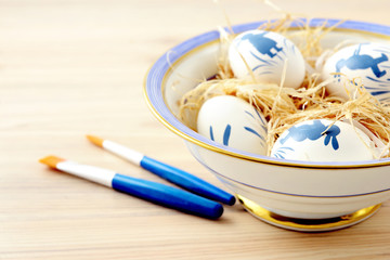 easter eggs in bowl and paint bush