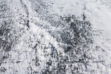 Nature patterns - snow and ice shaped by wind. Top view.