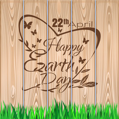 Earth Day lettering against the background of a wooden fence and green lawn. Earth Day design. 22 April. Vector illustration
