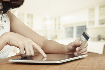 Woman shopping using tablet pc and credit card. Shopping online Concept.