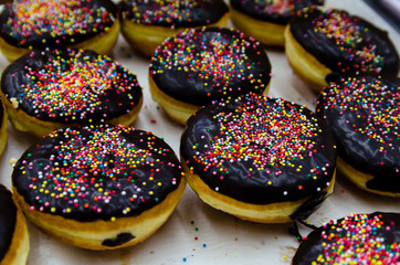 Fototapeta na wymiar Donuts with chocolate and colorful Topping.