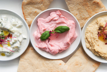 restaurant starter meal of a sharing platter of dips with bread