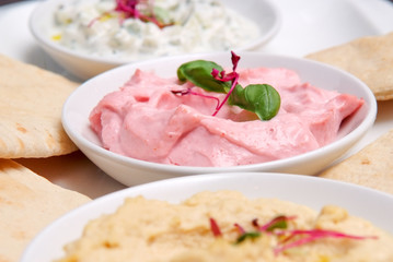 restaurant starter meal of a sharing platter of dips with bread