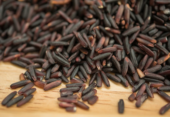 Riceberry in a wooden bowl .