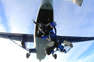 Fototapeta na wymiar Skydivers have just jumped out of a plane