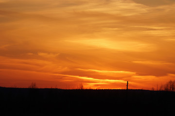 Beautiful orange sunset in the cloudy sky