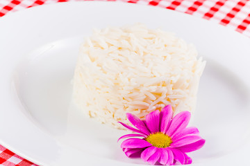 Boiled rice on white plate