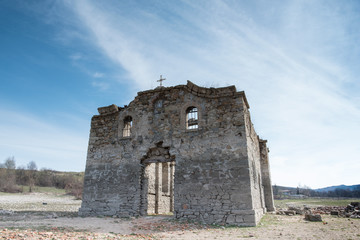 Fototapeta na wymiar Ruins of the old Eastern Orthodox church of Saint Ivan Rilsk. Abandoned church in dam Jrebchevo, Bulgaria
