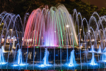 Colored fountain at might in circle inn Hai Phong, Vietnam