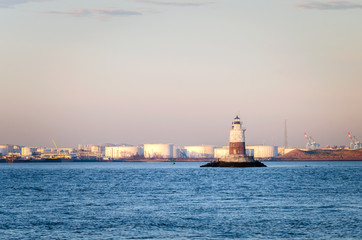 Robbins Reef Light in New York Bay at Dawn. Oil Tanks are visible in Background.
