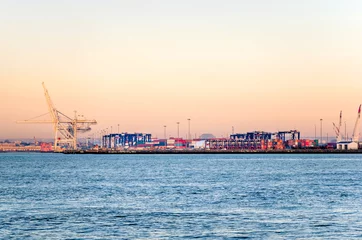 Foto auf Acrylglas Antireflex Tor Commercial Port full of Containers at Dawn