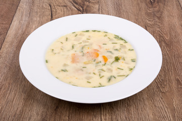 Vegetable soup on a wooden table