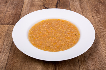 Vegetable soup on a wooden table
