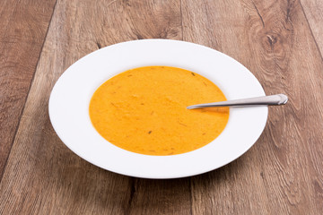 Vegetable soup on a wooden table