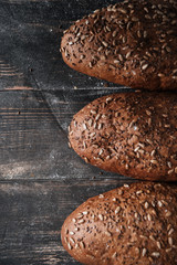 Bread on dark wooden table at bakery