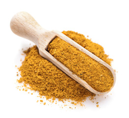 Curry spice in a scoop for spices