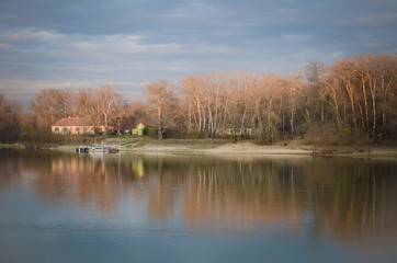Fototapeta na wymiar Reflection of the trees in the river