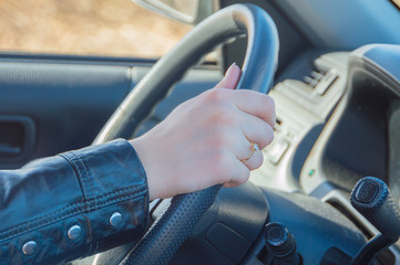 car held a woman's hand with the ring.