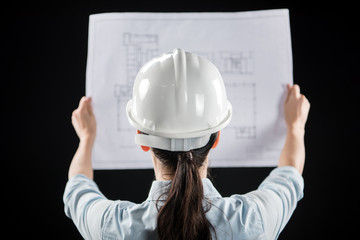 Female architect in helmet