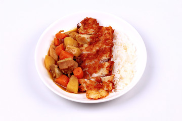 Rice with deep fried dolly fish in japanese yellow curry.