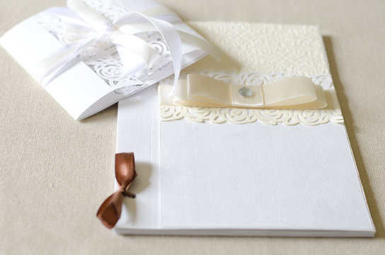 White wedding card with ribbons, space for text