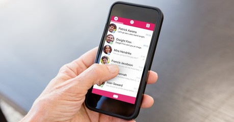 Cropped image of hand on using smart phone