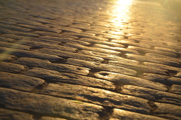evening paving stone in the rays of the sun