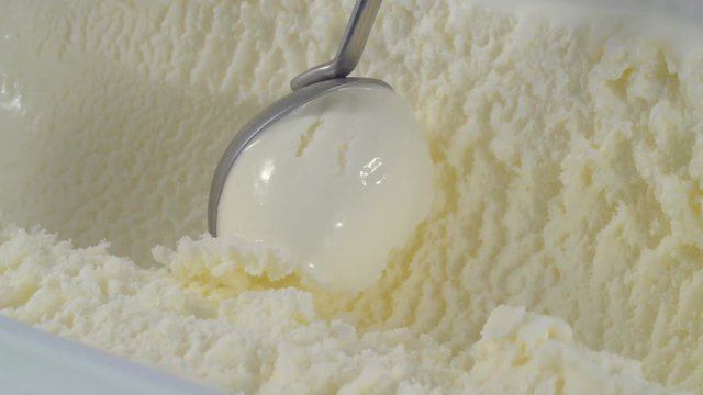 close up vanilla ice cream scooping out of container, 4K video