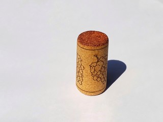 Closeup the bottle wine cork/stopper on white background, under sunlight.
