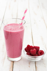 Raspberry smoothie on wooden table

