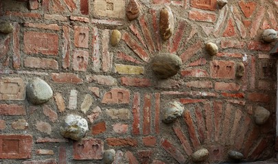 brick wall with decorative bricks and stones