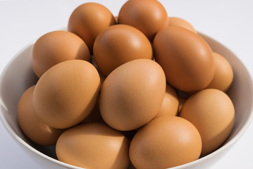 eggs in bowl on table white background