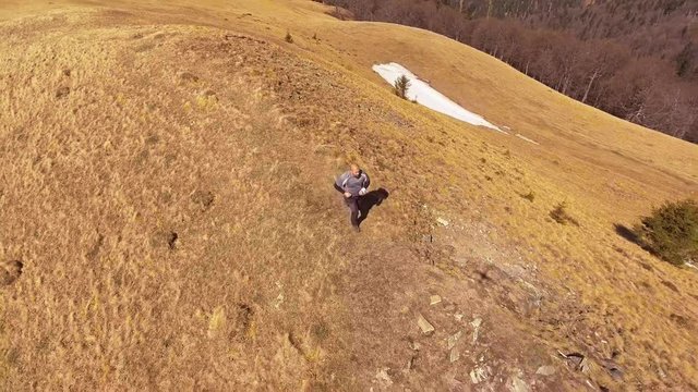 Runer On A Mountain Trail

