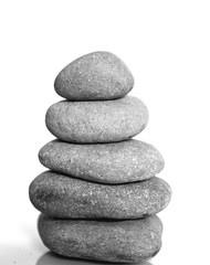 Zen spa stones isolated on white background. Balanced stones background with copy space.