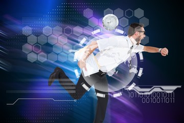 Composite image of geeky young businessman running late