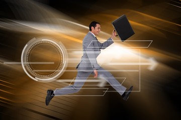 Composite image of businessman running with a suitcase