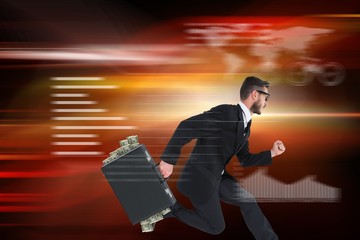 Fototapeta premium Composite image of running businessman