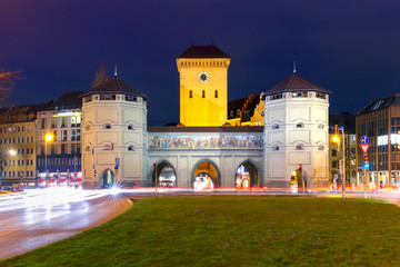 The Isartor gate, one of four main gates of the medieval city wall at night, Munich, Germany
