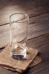 Empty glass on a wooden table