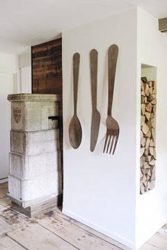 Interior decoration in an old swiss chalet renovated with a soapstone and a bonfire for wood heating