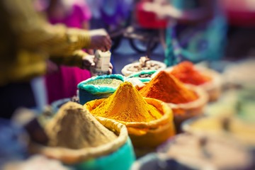 Colorful spices powders and herbs in traditional street market in Delhi. India.