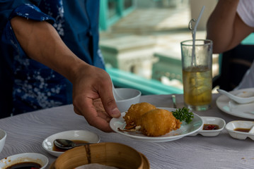 The staff are serving Crab fried baked inside crispy dough