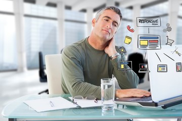 Fototapeta premium Businessman using laptop with icons 