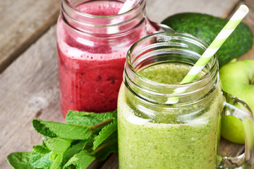 Healthy green and red smoothie in glass mug