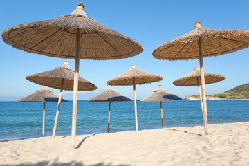 Group of parasol at beautiful Greece seashore
