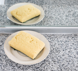 Old sponge on the white dish.