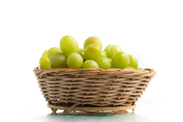 White Grapes into a Basket