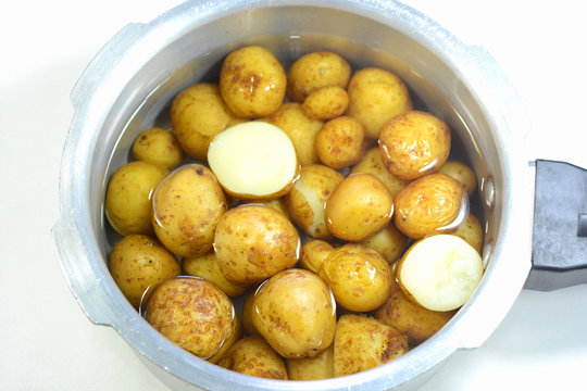 Cooked Potatoes In A Pressure Cooker Soaked In Water.