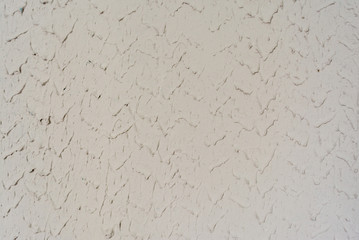 Texture of painted plaster wall relief inside, abstract background