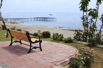 Fototapeta na wymiar Bench overlooking sea